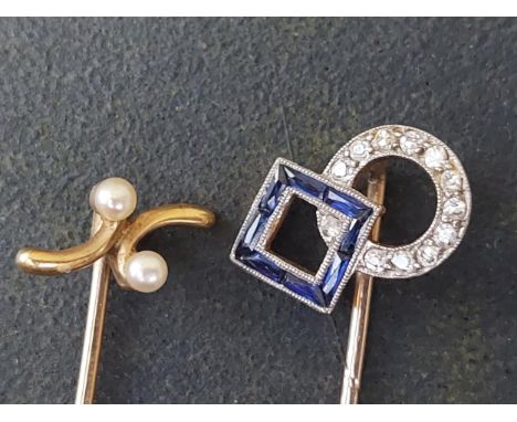 A sapphire &amp; diamond set stick pin and one other. (2)