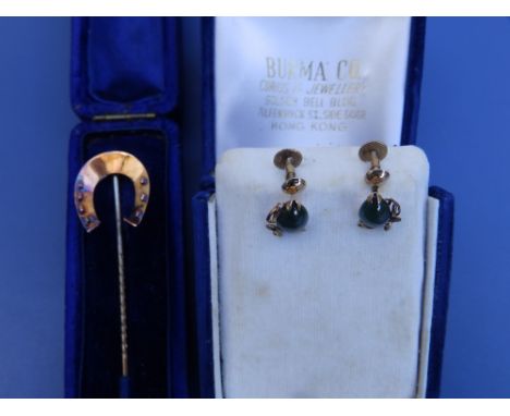 A 15ct horseshoe stick pin and a pair of 14K earrings. (3)