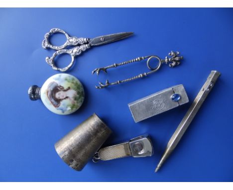 A 20thC Hukin &amp; Heath Birmingham silver tot measure, a Birmingham silver cheroot cutter, an 800 standard lipstick holder 
