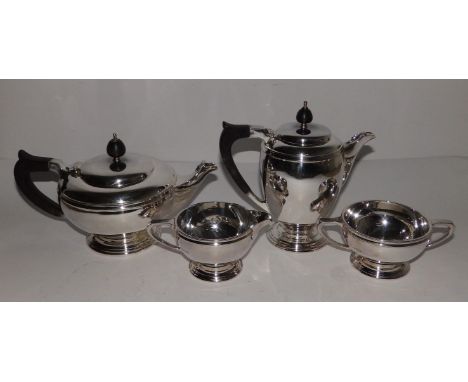 A boxed Mappin &amp; Webb four piece silver tea &amp; coffee service in the early 20thC style, of plain circular plan, the te