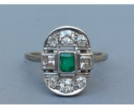 An emerald &amp; old cut diamond oval panel ring in white metal.  Finger size R/S.