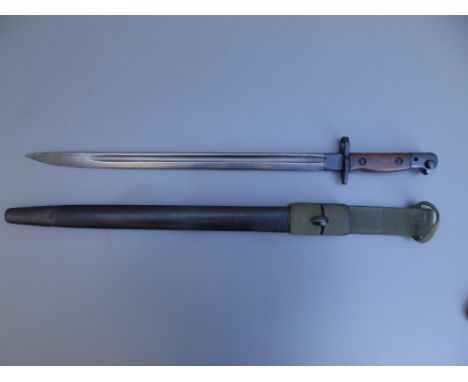 A 1907 pattern Wilkinson bayonet with 17" blade in scabbard.