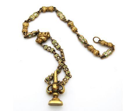 Oro basso titolo e smalti. Peso 9 gr.Low title gold and enamels. Weight 9 g.