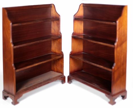 An attractive pair of Georgian style mahogany waterfall four shelf Bookcases, on bracket feet, approx. 122cms x 97cms (48" x 