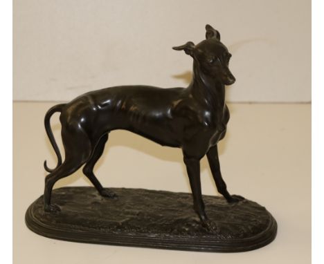 A 19th Century metal, pewter? Model of a Whippet, 9cms (7 1/2") high. (1)