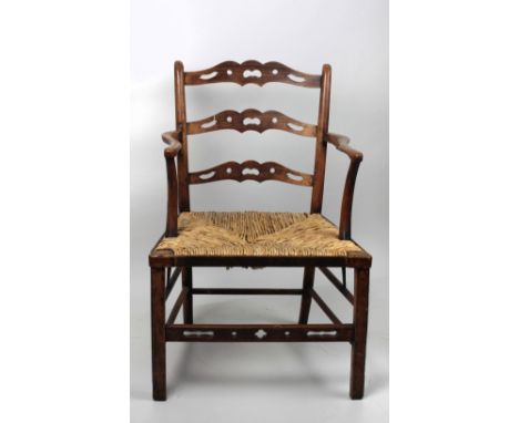An Irish early 19th Century style ladder back Armchair, with Súgán seat; and a similar old rocking Chair. (2)