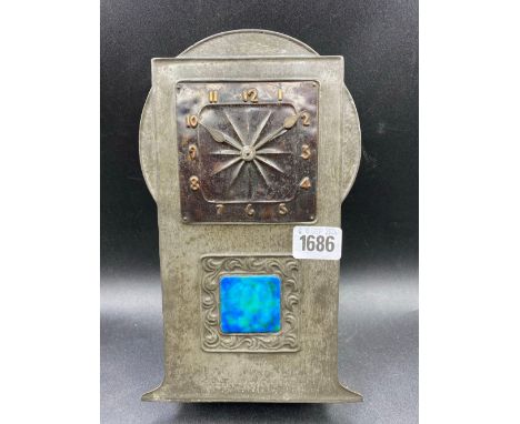 An Art Nouveau Tudric pewter cased clock with gilt numerals and enamel panel, stamped 0383, 9.5 inches high