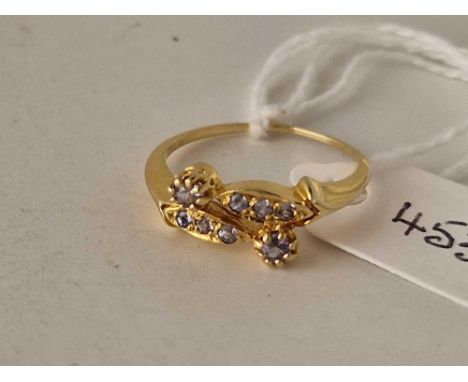 A blue stone fancy cross over ring 18ct gold size M 2.4 gms