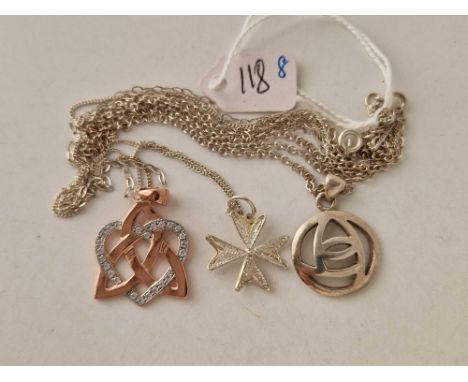 Three silver necklaces including a celtic style example