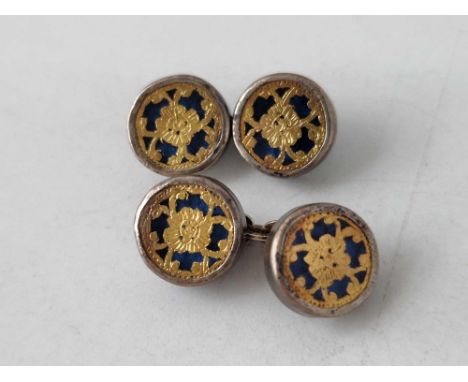 A pair of antique silver mounted cufflinks with gold inlay into blue enamel