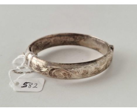 A engraved silver bangle 21 gms