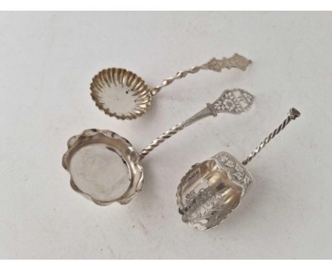 A scoop shaped caddy spoon, two sifter spoons