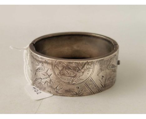 A engraved silver bangle with bird decoration 30 gms