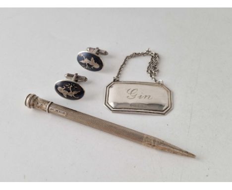 A silver wine ticket pencil and a pair of cufflinks