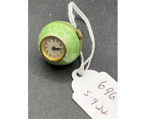 An unusual green Champleve enamel ball watch
