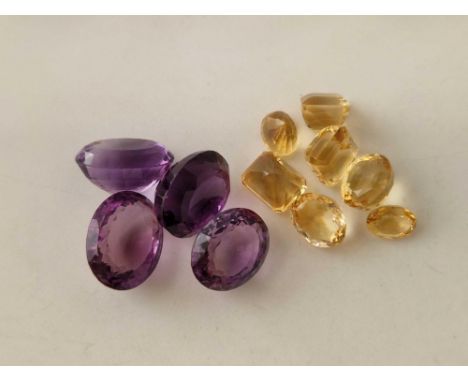 A bag of assorted citrine and amethyst stones