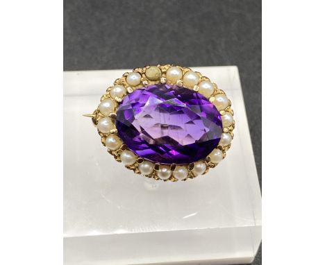 An amethyst and pearl brooch in high carat