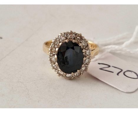 A SAPPHIRE AND DIAMOND OVAL CLUSTER RING 18CT GOLD SIZE M 5 GMS BOXED