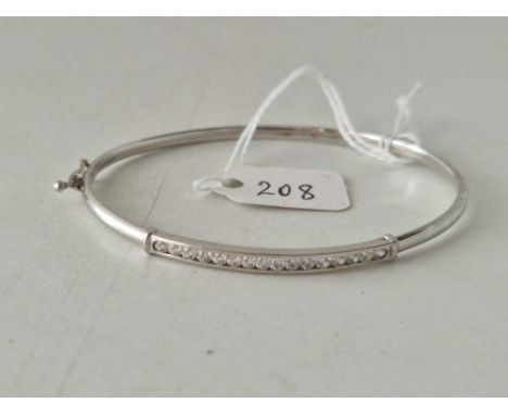 A hinged stone set white gold bangle 9ct 4.1 gms