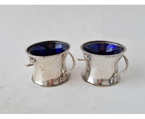 A pair of Art Nouveau salts with stylish handles, two inches diameter, Chester 1921, 60 g excluding BGL  (BGL A/F)