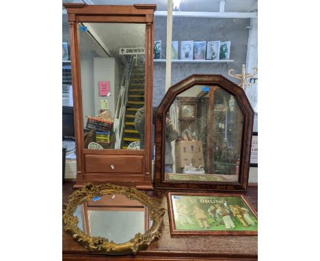 A group of three wall mirrors and an advertising print to include a painted pier mirror, an oval gilt framed mirror and a mir