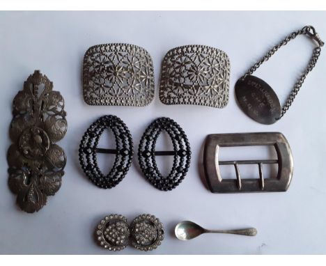 A group of buckles to include an early 20th Century silver William Neadham buckle and other items to include a Sterling silve