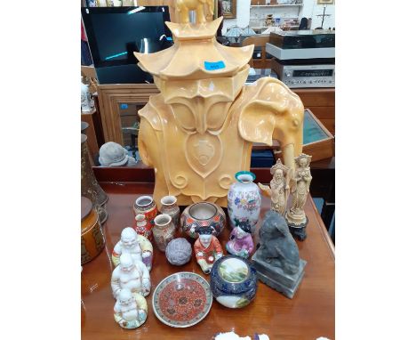 A Kamini Potteries of Ascot yellow glazed pottery elephant planter with pagoda lid, A/F, together with mixed mid to late 20th
