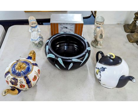 A mixed lot to include a Poole pottery bowl, Royal Staffordshire Merlin ware teapot and one other teapot, a pair of Nao figur