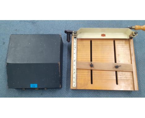 A Remington home portable typewriter in case, together with a vintage Veteren Series paper guillotine 