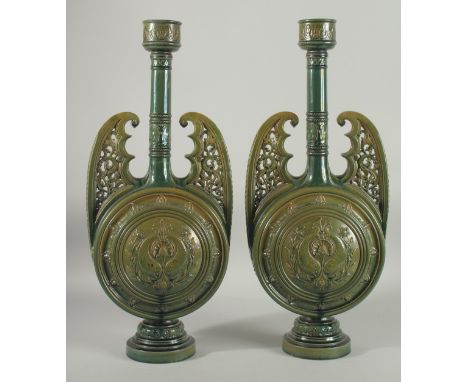 A PAIR OF 19TH CENTURY GREEN HISPANO-MORESQUE GLAZED CERAMIC CANDLESTICKS / VASES, 60cm high.