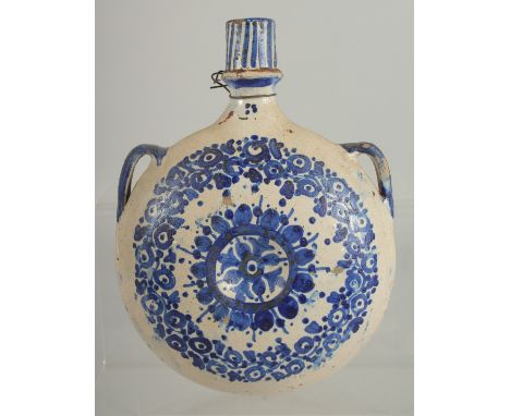 A 19TH CENTURY MOROCCAN POTTERY PILGRIM WATER FLASK, 21.5cm high.