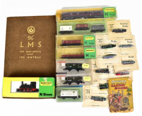 MINITRIX; an N gauge 2914 locomotive, with a maroon coloured carriage and three wagons, with a Fleischmann carriage, a box se