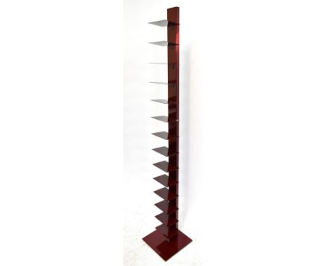 A vintage metal red painted bookshelf, height 200cm.Additional InformationIt is all metal and the shelves are fixed into posi