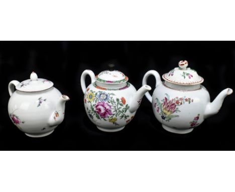 Three 18th century teapots, each of bulbous form with floral decoration, height of largest example 14cm (3).Additional Inform
