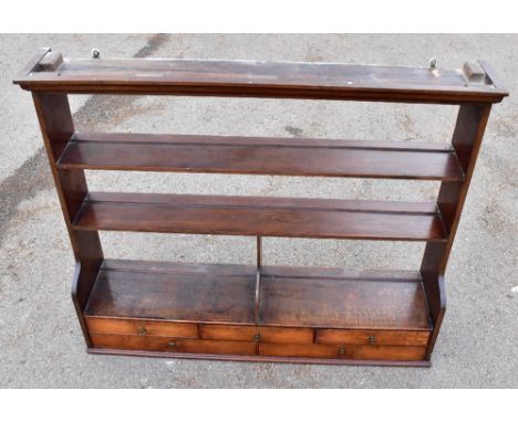 A George III oak hanging shelf, with five drawers, height 84cm, width 101cmAdditional InformationGeneral age wear patina to t