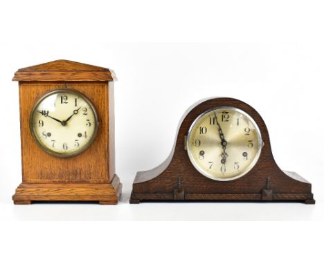 A late 19th century oak cased mantel clock, a circular painted dial with Arabic numerals, height 32cm, together with a furthe