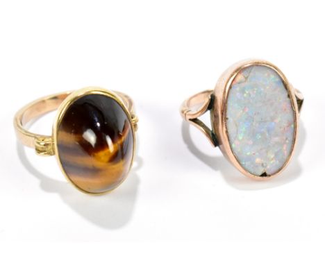 A 9ct yellow gold dress ring set with single oval shaped opal, approx 2 x 1.2cm in size, size approx O, together with a 9ct y