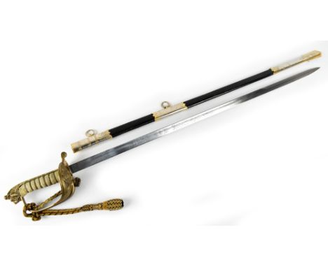 An Elizabeth II naval sword, with 78.5cm acid etched blade, with crowned EIIR cypher, and named for Wilkinson Sword, the blad