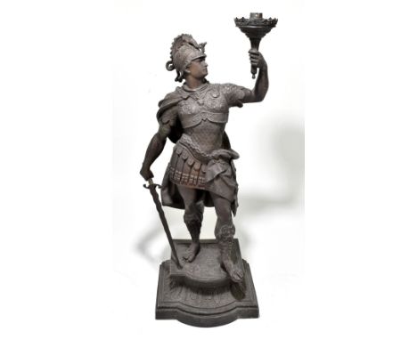 A large circa 1900s spelter lamp modelled as a warrier upon a stepped plinth, height 64cm.