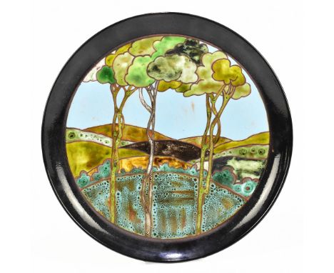 POOLE; a circular wall charger.Additional InformationCrazing to the underside, wear, light scratches to the surface.