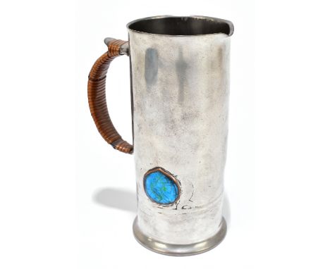ARCHIBALD KNOX FOR LIBERTY & CO; an Arts and Crafts pewter and enamel ewer, with wicker bound handle, stamped shape number 02