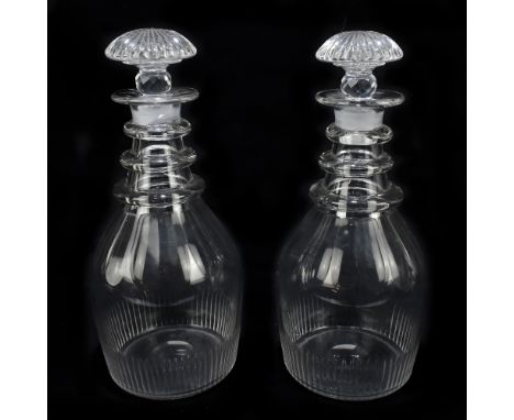 A pair of Georgian clear glass decanters with faceted and wheel cut decoration, height 16cm (2).Additional InformationSadly o