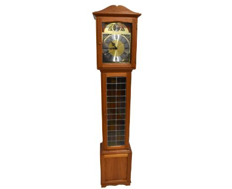 GADBJERG; a teak longcase clock, with brass dial and silvered collar chapter ring, and stained lead glass door, above a panel