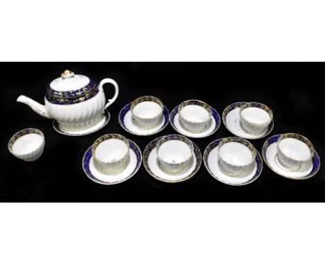 An early 19th century English porcelain seventeen piece part tea service to include a teapot and cover with stand.Additional 
