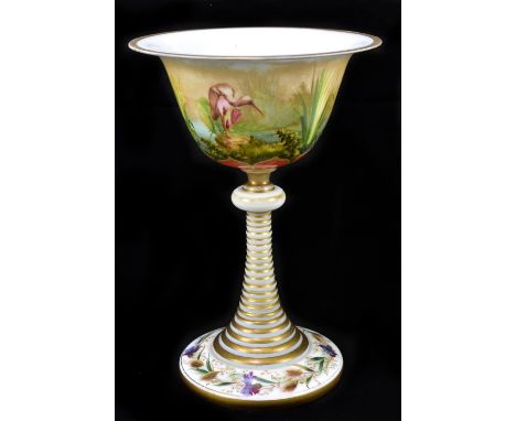 A late 19th century Bohemian opaque glass, gilded and painted chalice with flared rim, the bowl decorated with three storks w