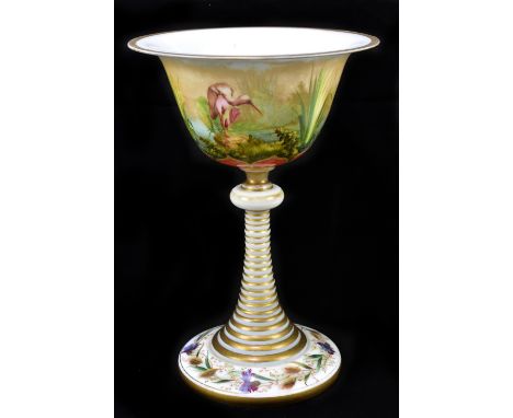 A late 19th century Bohemian opaque glass, gilded and painted chalice with flared rim, the bowl decorated with three storks w