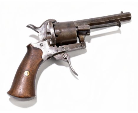 A 7mm pinfire revolver, with wooden stock and various proof marks to the side of the octagonal barrel and chamber barrel, len