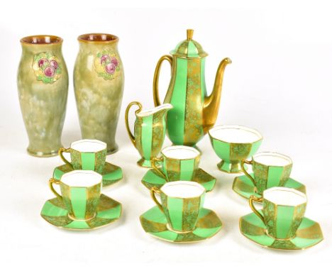 ROYAL DOULTON; a pair of stoneware Art Nouveau floral decorated mottled green ground vases, impressed marks to base, also inc