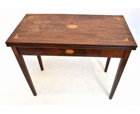 A George III inlaid mahogany fold over tea table, raised on tapering block legs, width 90cm, depth 44cm, height 76cm.Addition