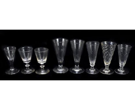 Eight late 18th century and later glasses including a cordial glass, an ale glass, three examples with relief scrolling detai